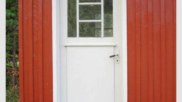 Sjoa stasjon (Fotograf: Dagmar Buen © Fylkesarkivet i Oppland). Bilde av dør ved Sjoa stasjon